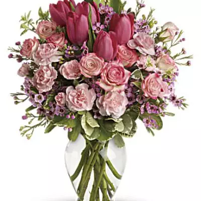 It's beauty-full! Bursting with tantalizing tulips and radiant roses, this delightful pink arrangement brings spring joy to that special someone.
Includes pink roses, tulips, carnations and waxflower, accented with fresh pitta negra and variegated pittosporum.
Delivered in a lovely glass vase.