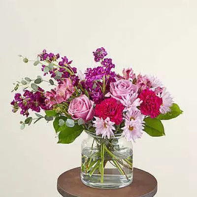 Send our Lollipop Bouquet as a sweet Mother's Day treat or to an unexpecting friend. Designed with berry hues that will brighten their day and fill their room with purple carnations, lavender roses and daisies. These happy stems are paired with beautiful eucalyptus for a stunning spring aesthetic.